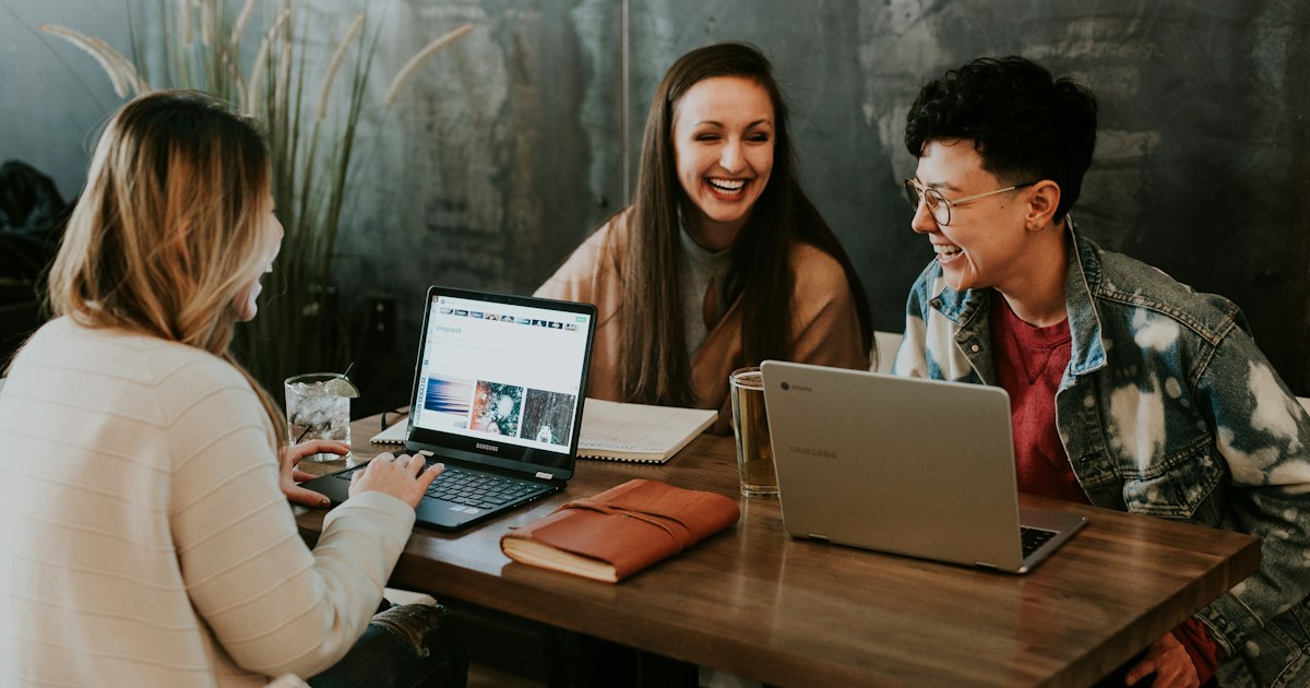 Colleagues connecting digital tools at work