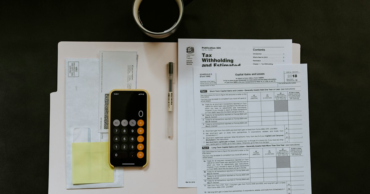 Calculator and financial documents on a desk